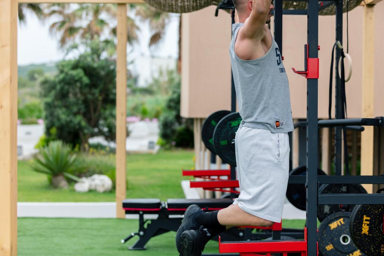 La Mer Resort & Spa - Adults Only Джорджополис Екстериор снимка A man performing a kneeling squat with a barbell